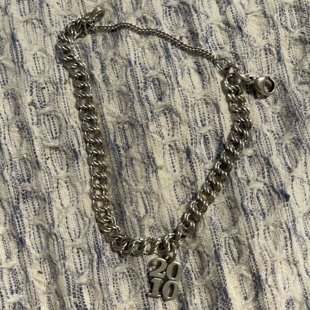 “2010” James Avery Charm attached to small original charm bracelet.